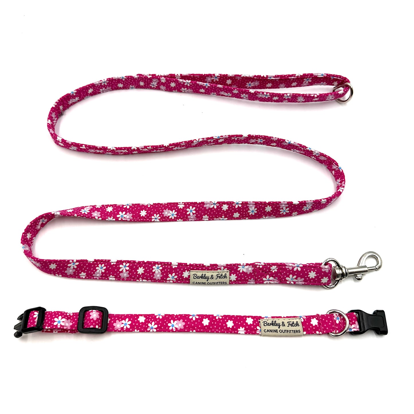 Pink floral dog collar and leash set on a white background