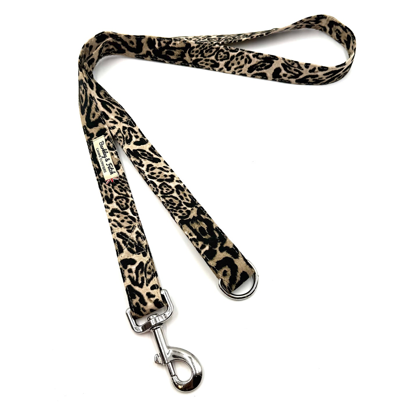 Leopard print dog leash with metal clip on a white background