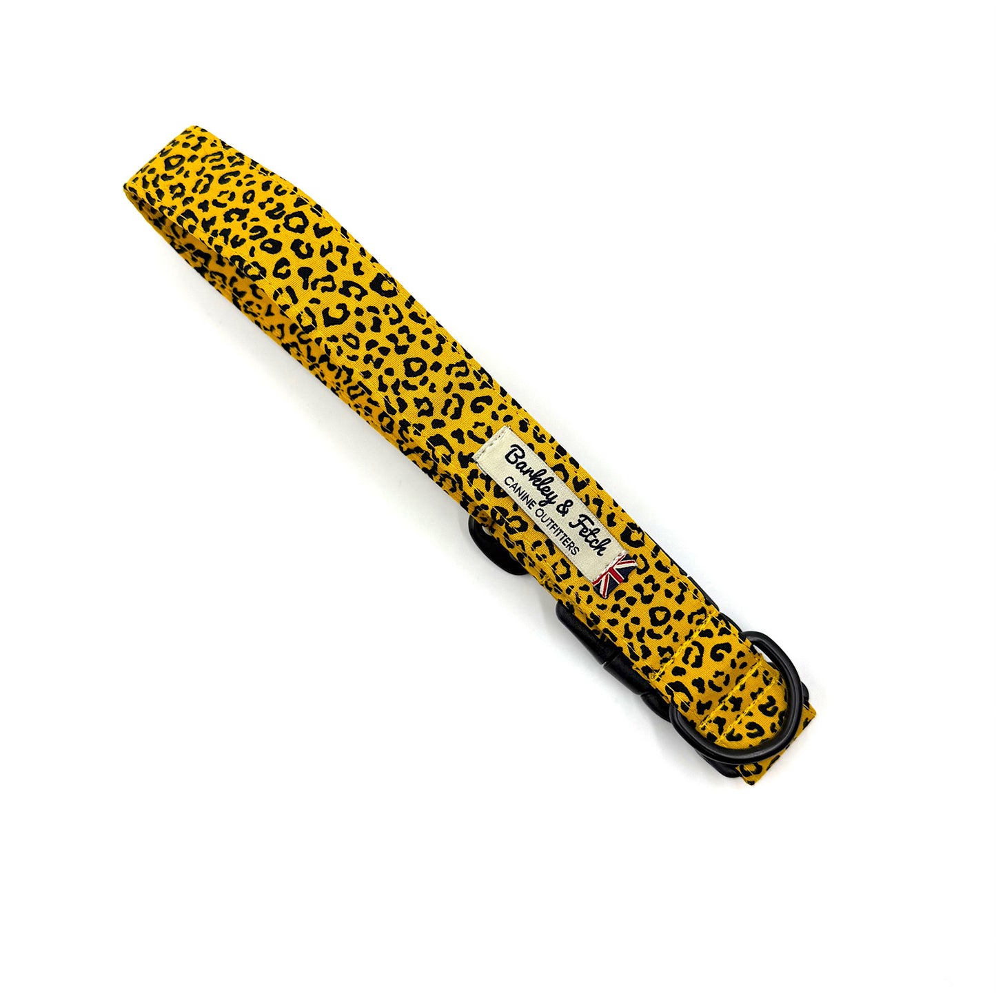 Yellow dog leash with black leopard print pattern on a white background