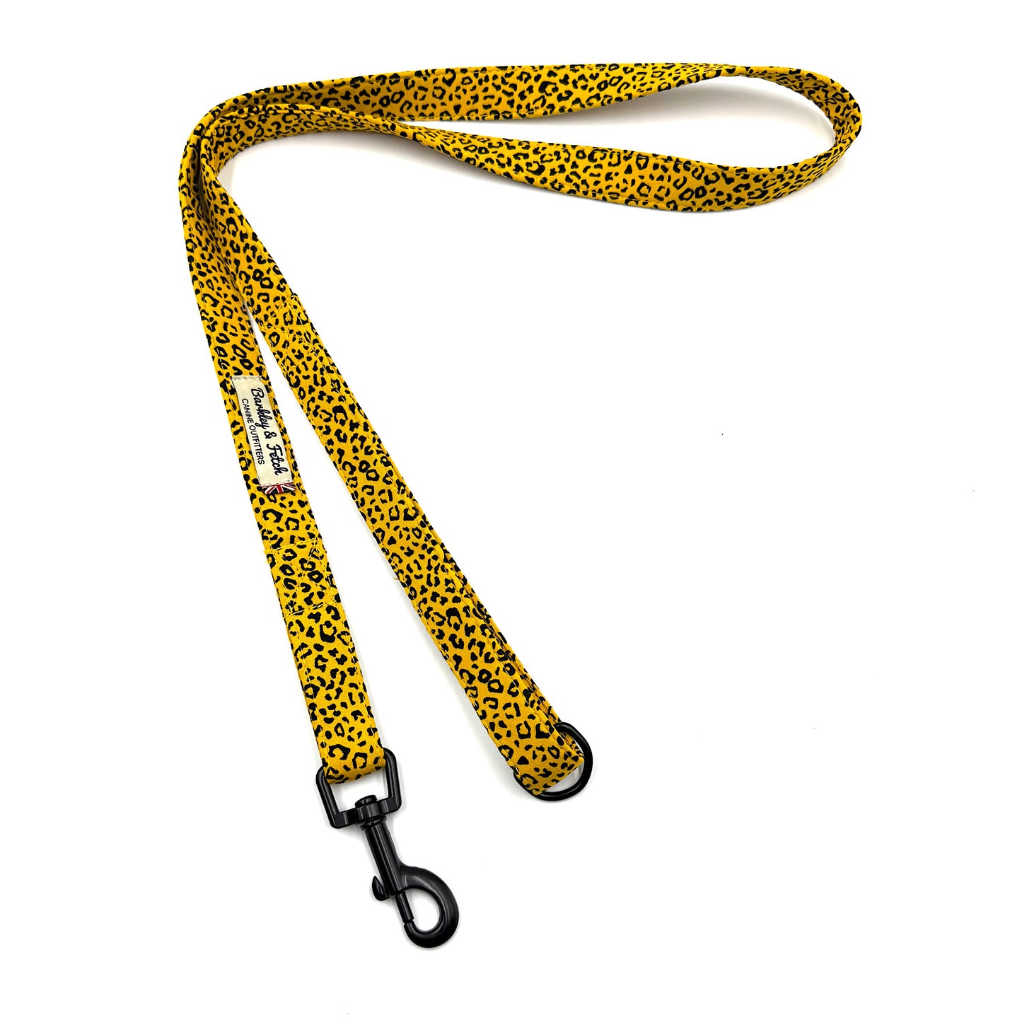 Yellow leopard print dog leash with a black clip on a white background