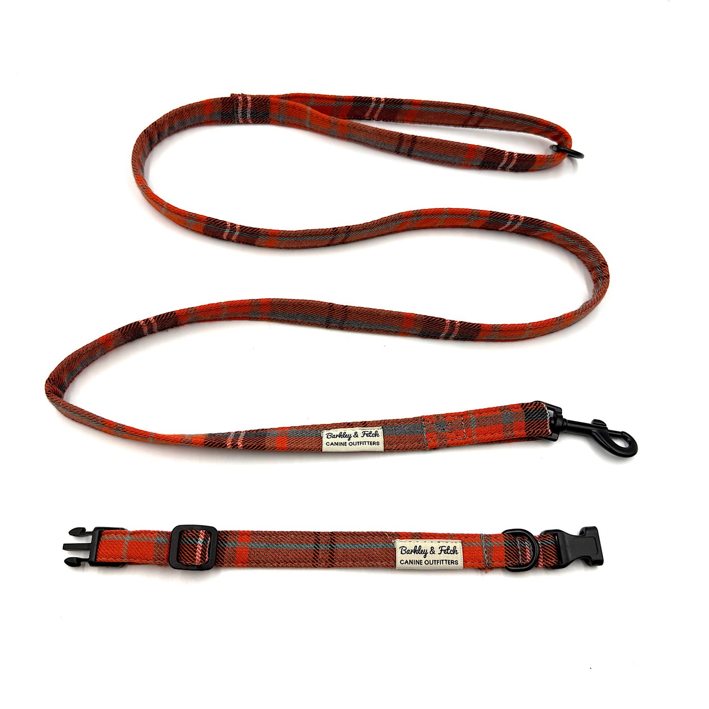 orange and black plaid dog leash with a clip and a collar on a white background