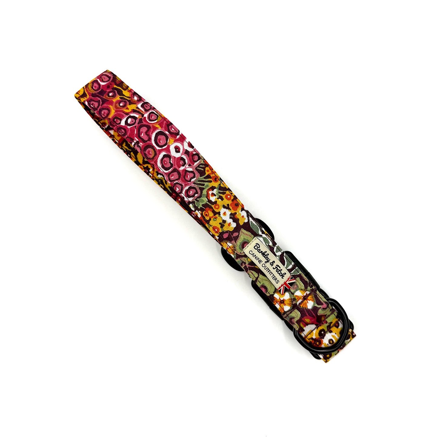 Colorful patterned dog collar with brand name on a white background