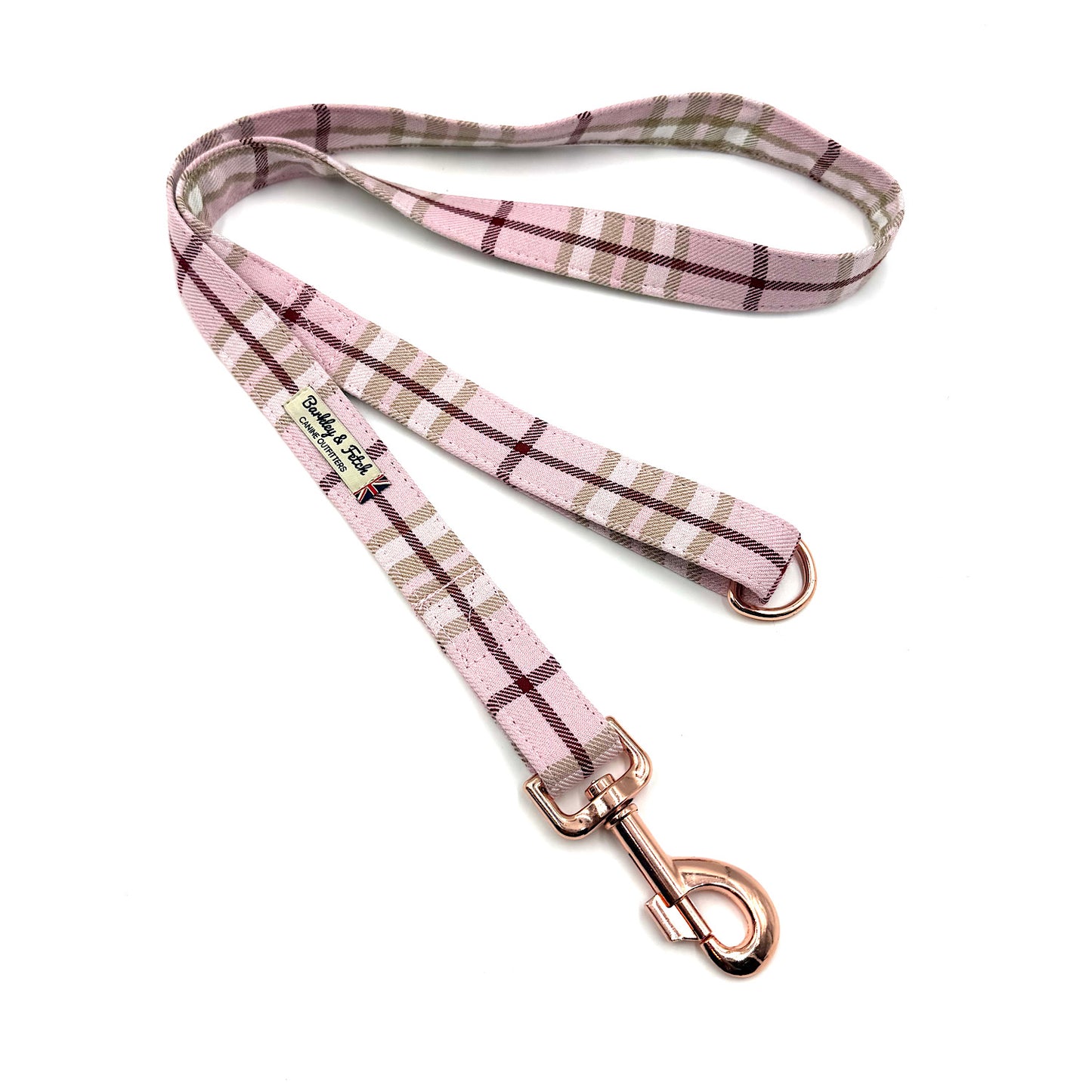 Pink plaid dog leash with rose gold hardware on a white background