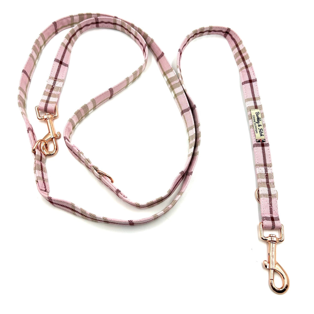 Pink plaid dog leash with gold hardware on a white background. Handmade in the UK by Barkley and Fetch