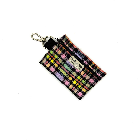 Plaid keychain pouch with a visible brand label on a white background