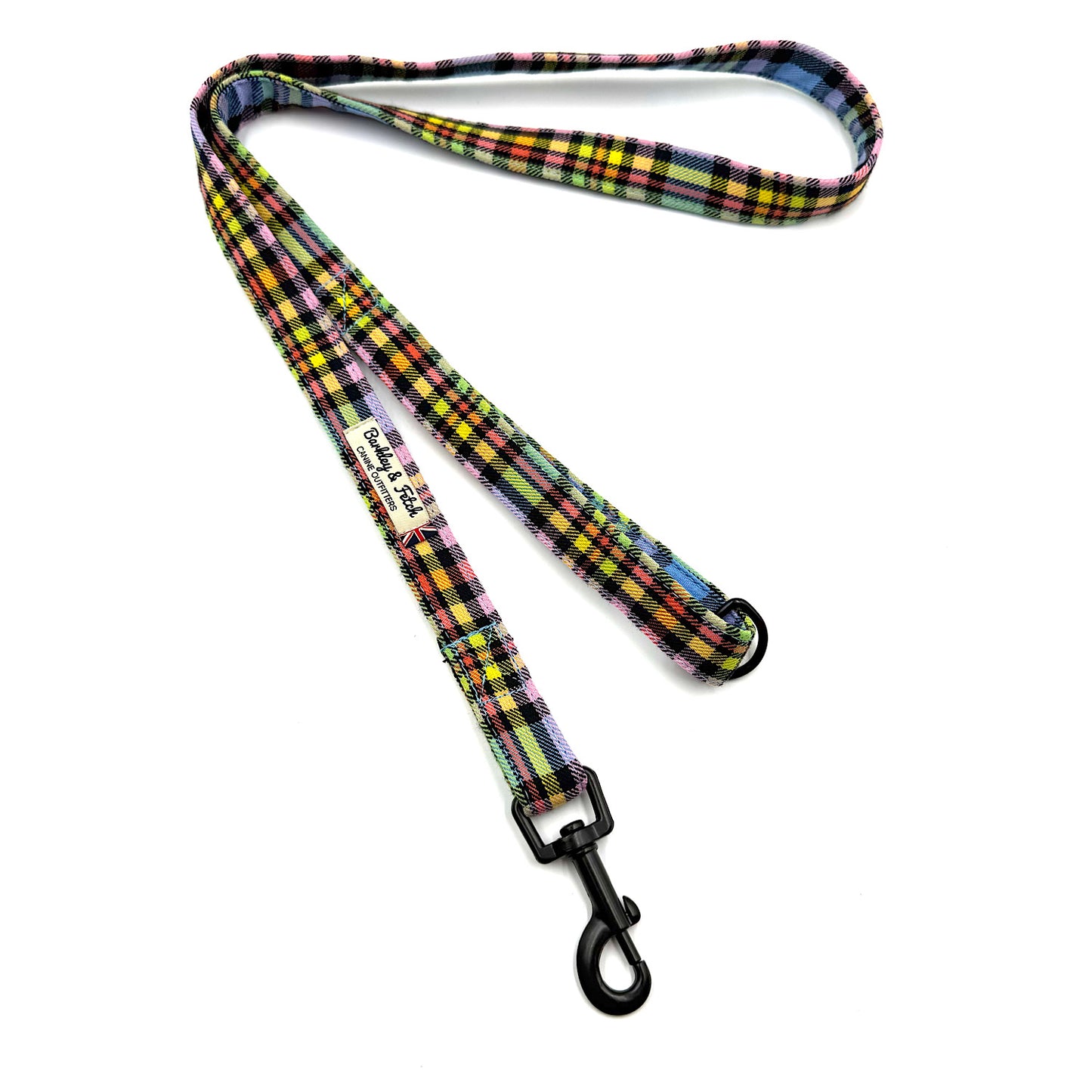 Colorful plaid dog leash with a black clip on a white background