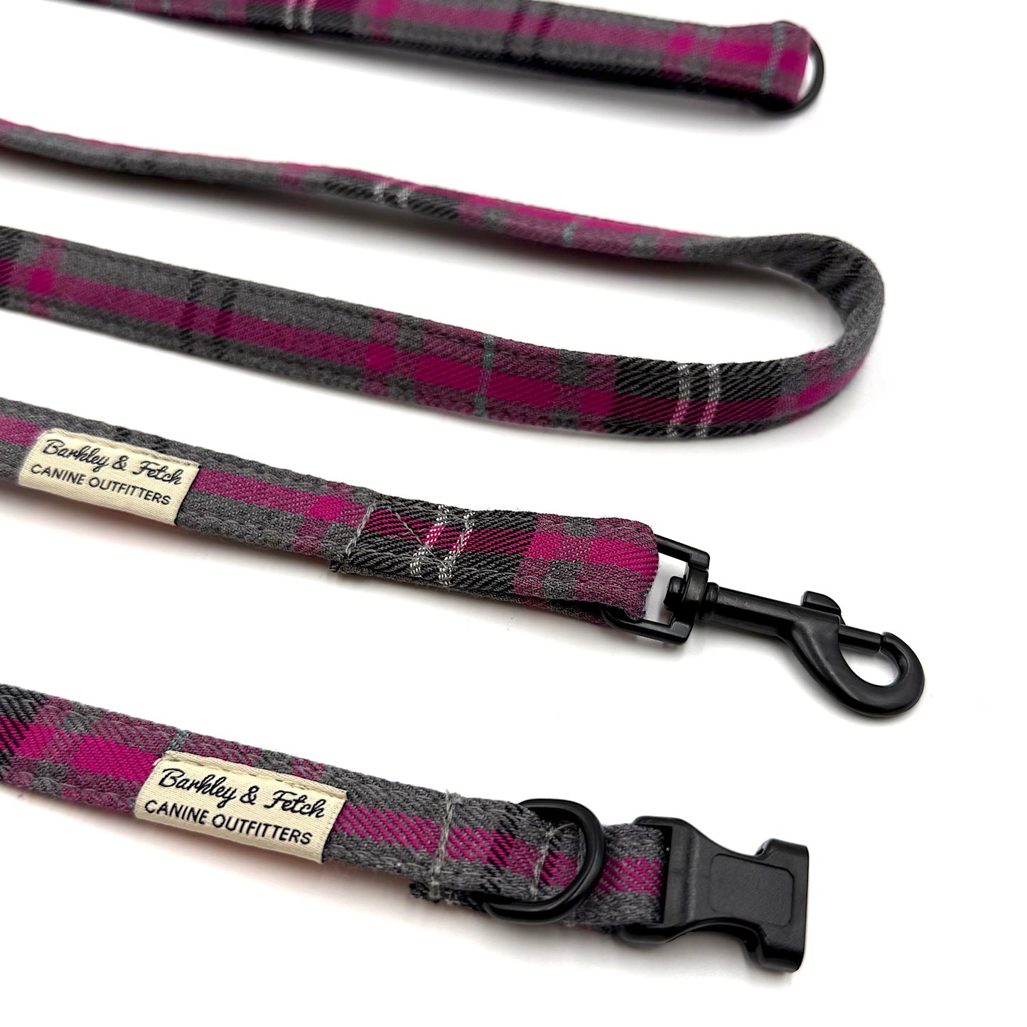 Plaid dog leash with visible brand label on a white background