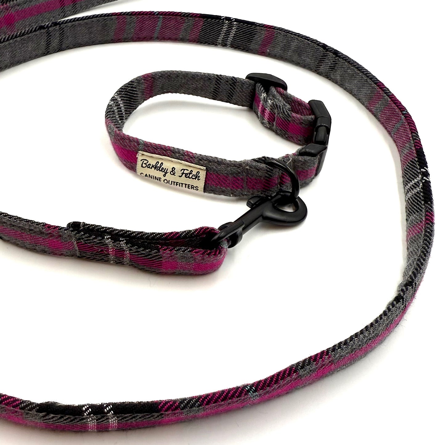 Plaid dog collar and leash set with a visible brand label on a white background