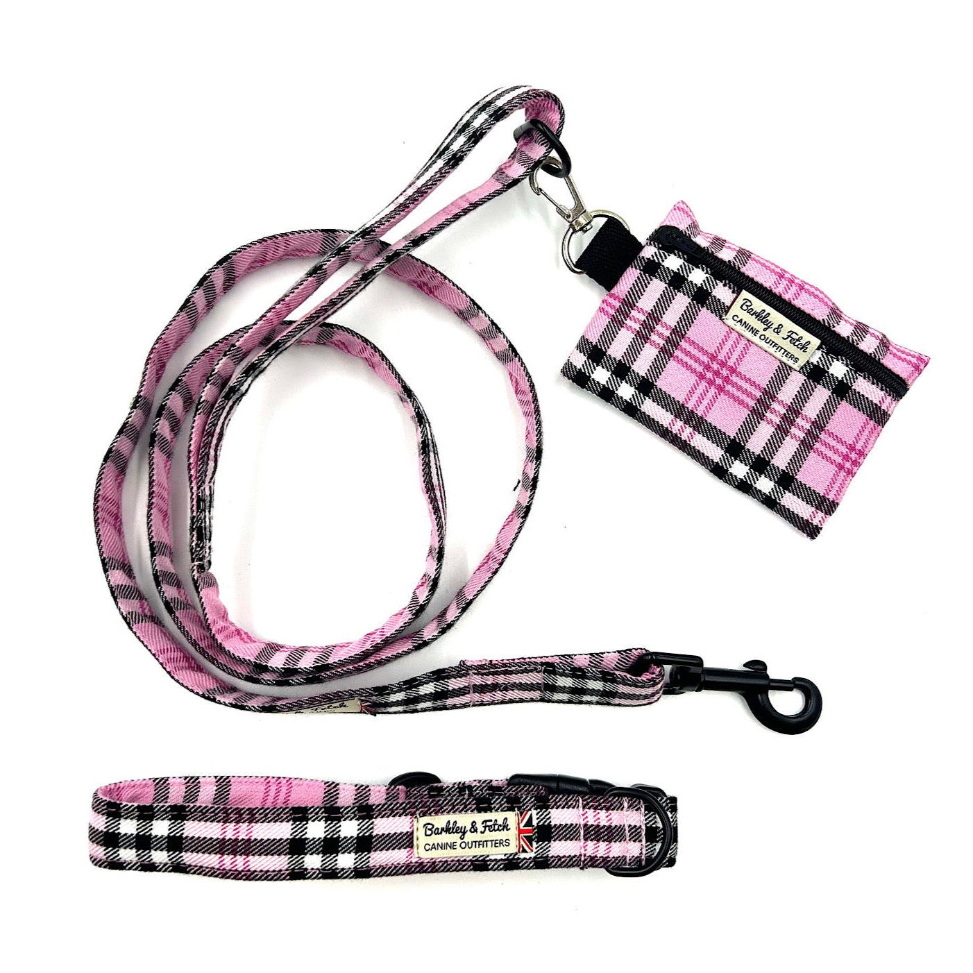 Dog leash, collar, and tag set with pink and black plaid pattern on a white background
