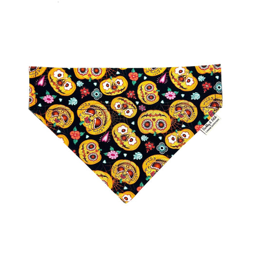 Dog bandana with colorful skull design on a black background handmade by barkley and fetch uk