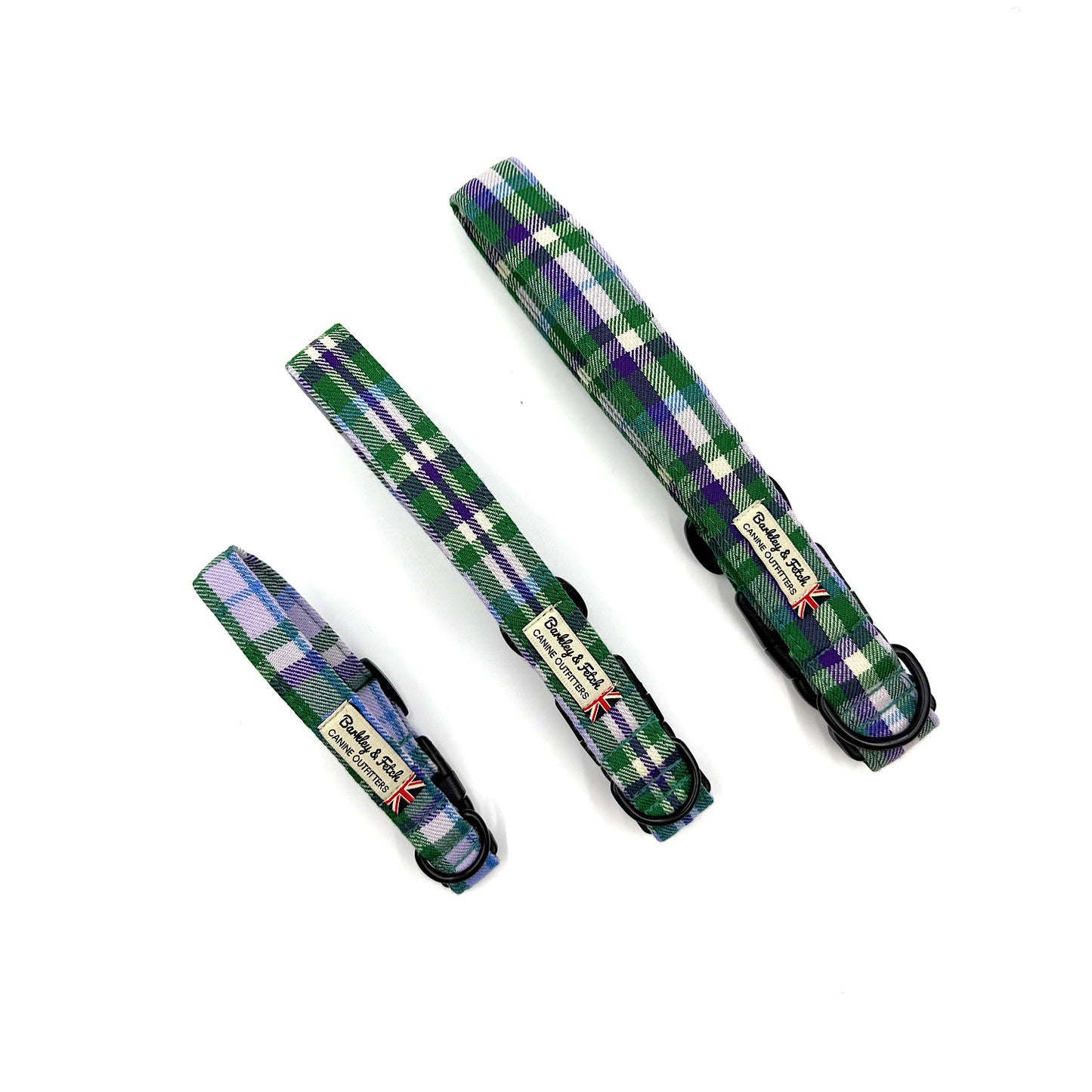 Set of plaid dog collars in green, purple, and white on a white background