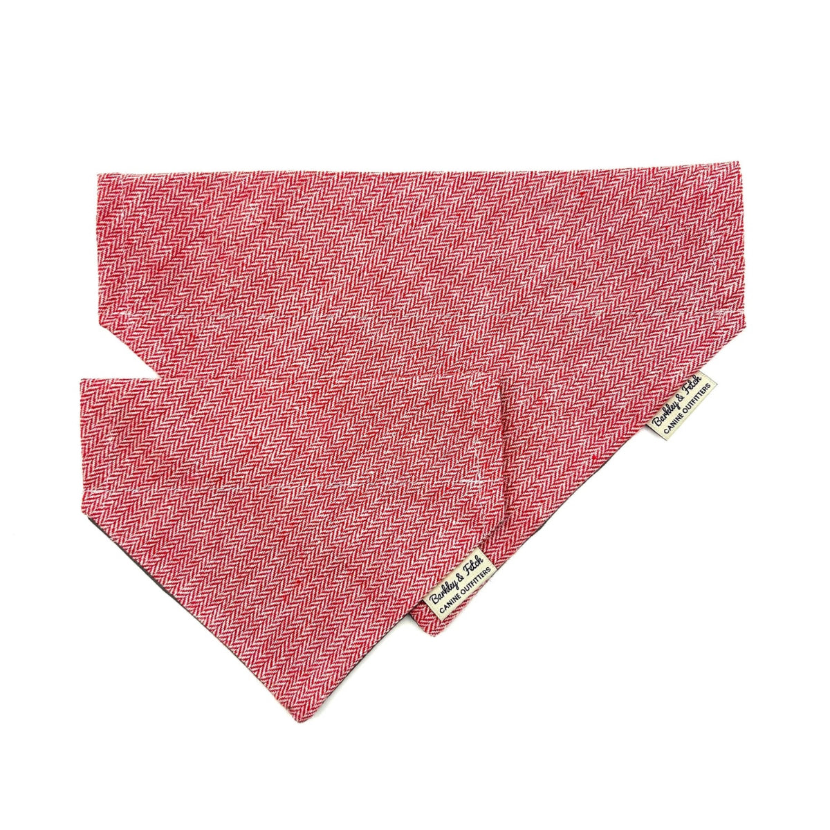 Red herringbone patterned dog bandana with a brand label on a white background