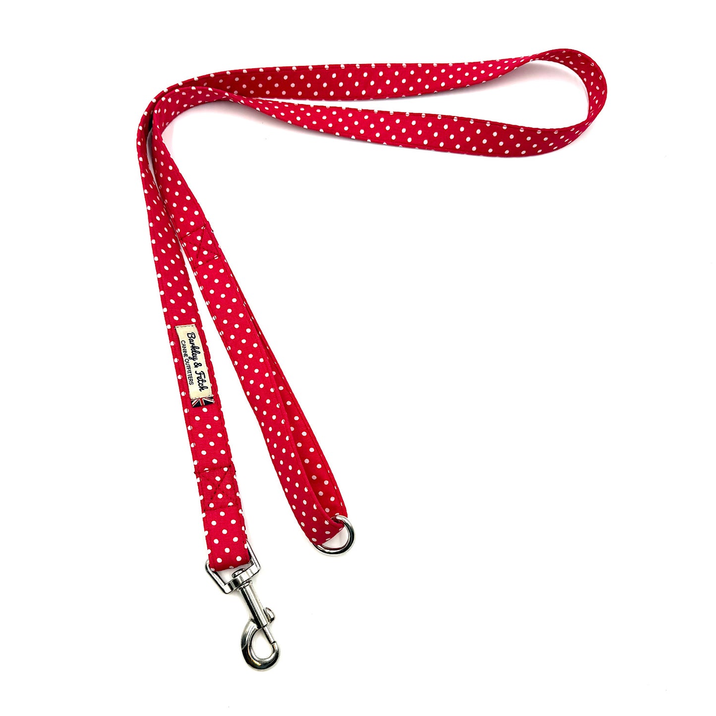 Red polka dot dog leash with metal clip on a white background