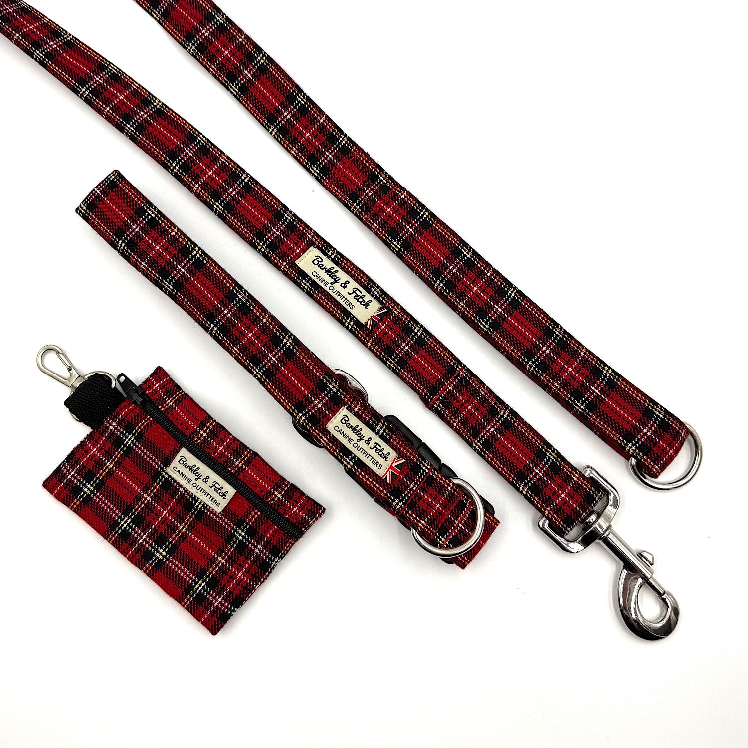 Red plaid dog leash and matching pouch with visible brand label on a white background