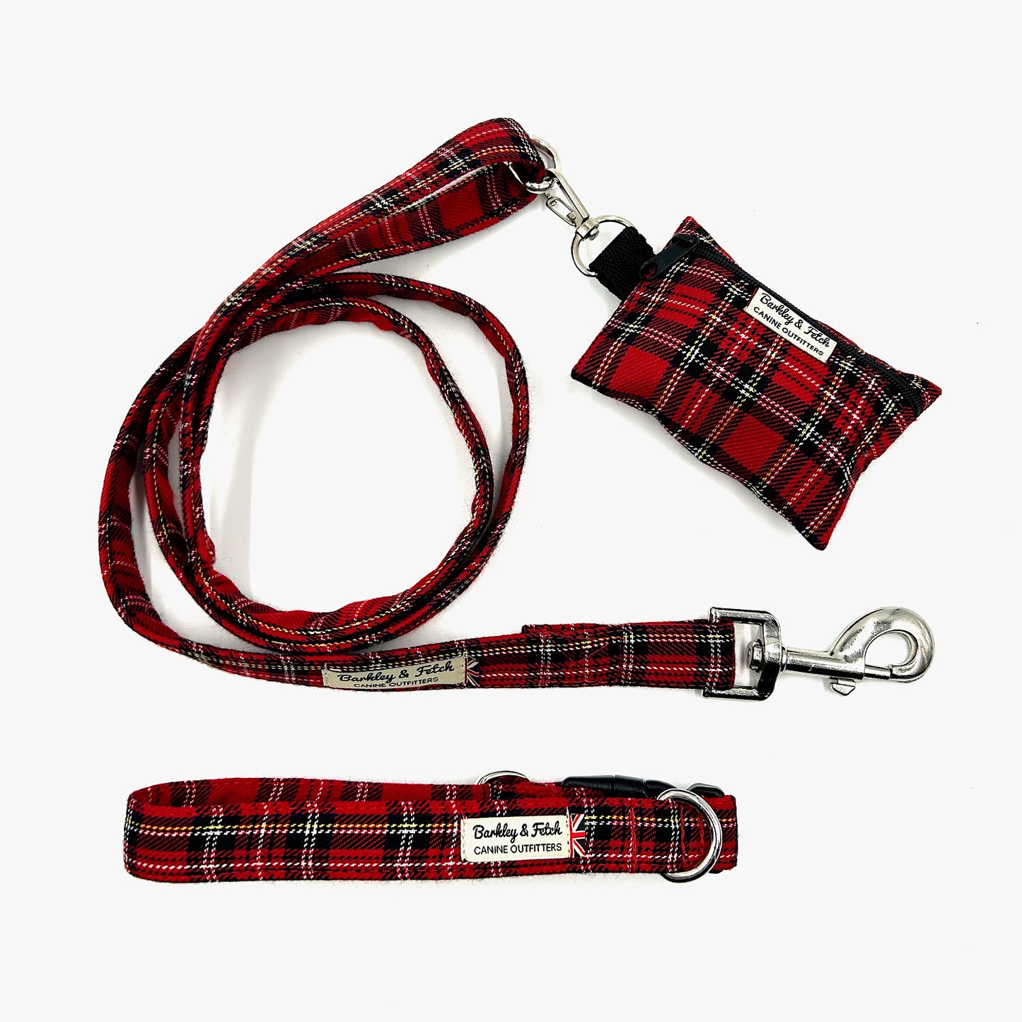 Red plaid dog leash, collar, and pouch on a white background