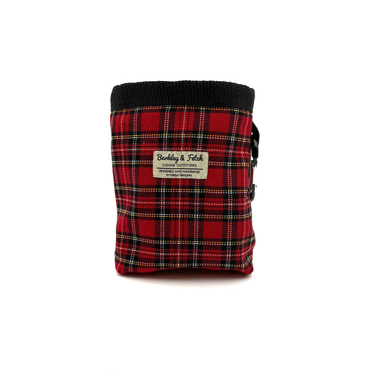 Red plaid fabric pouch with black top on a white background