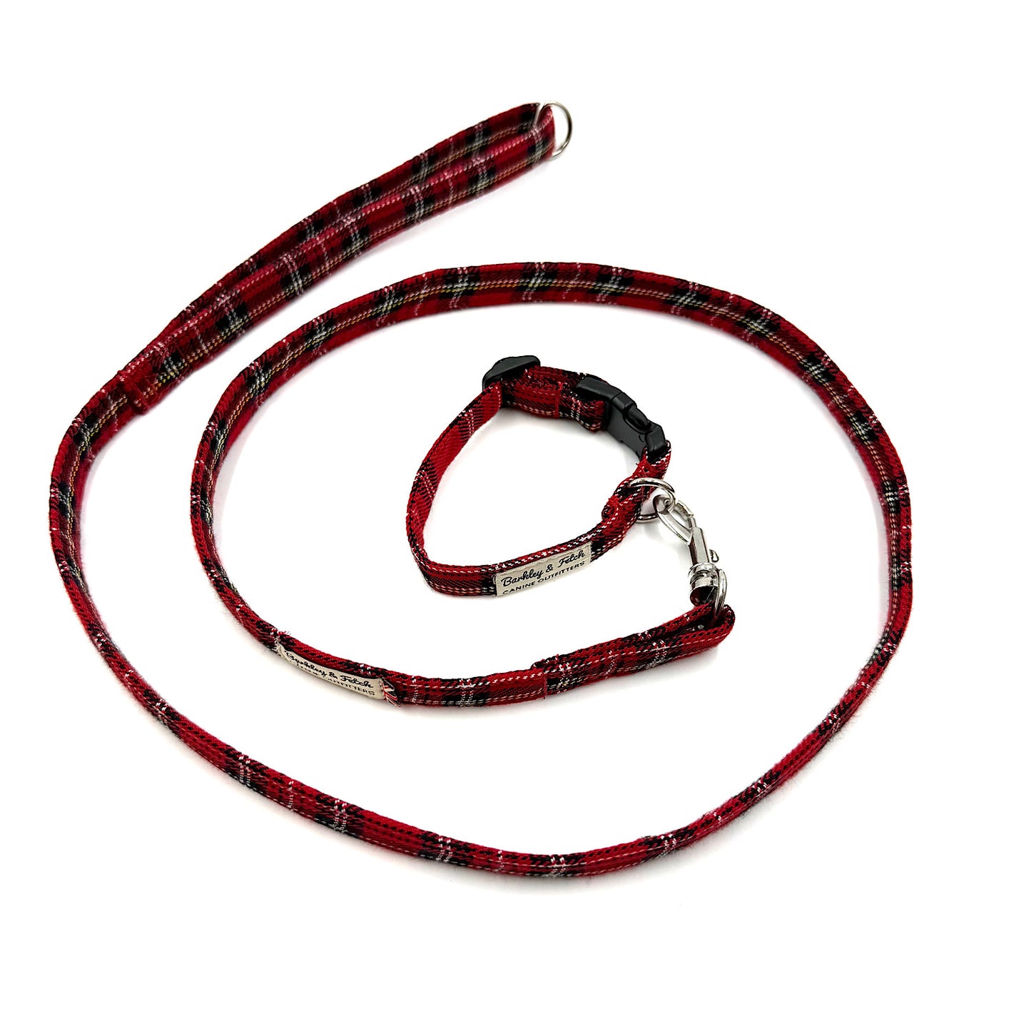 Red plaid dog leash and collar set on a white background