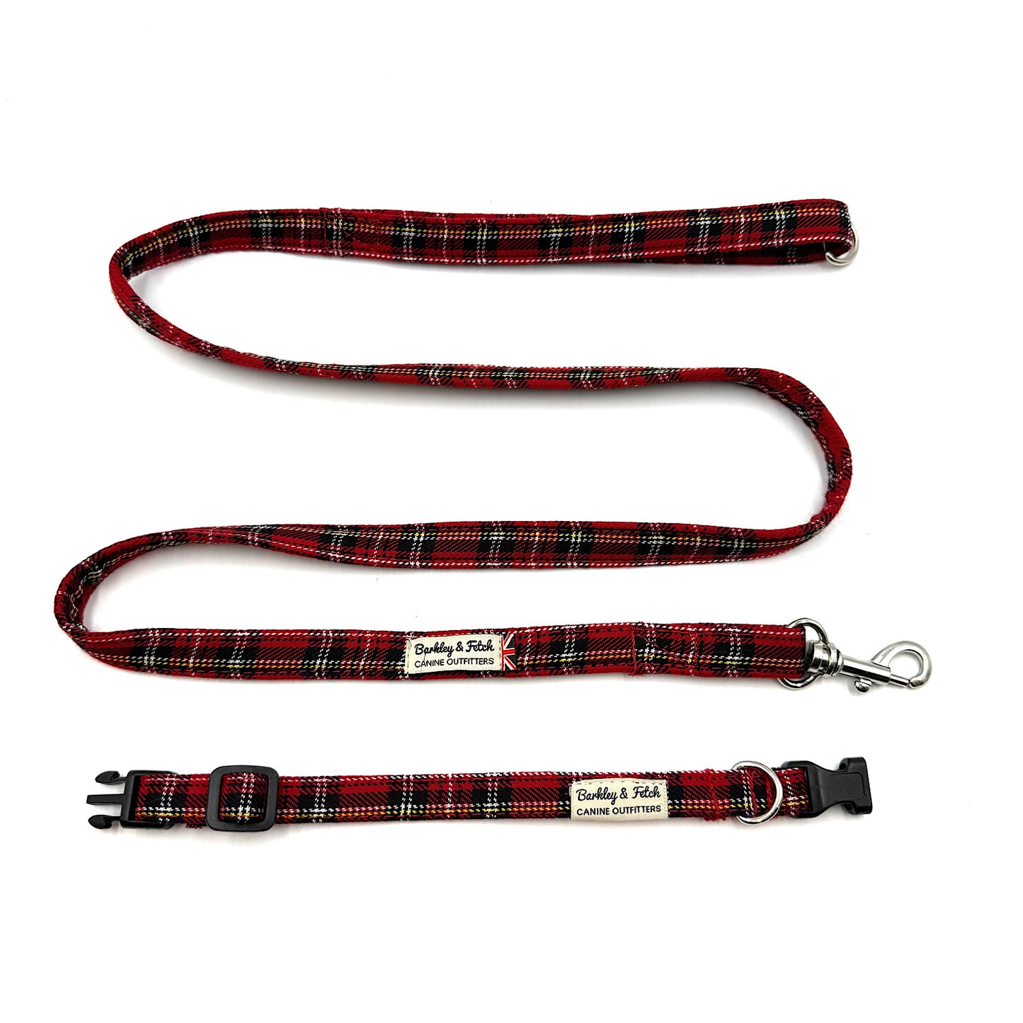Red and black plaid dog leash and collar set on a white background