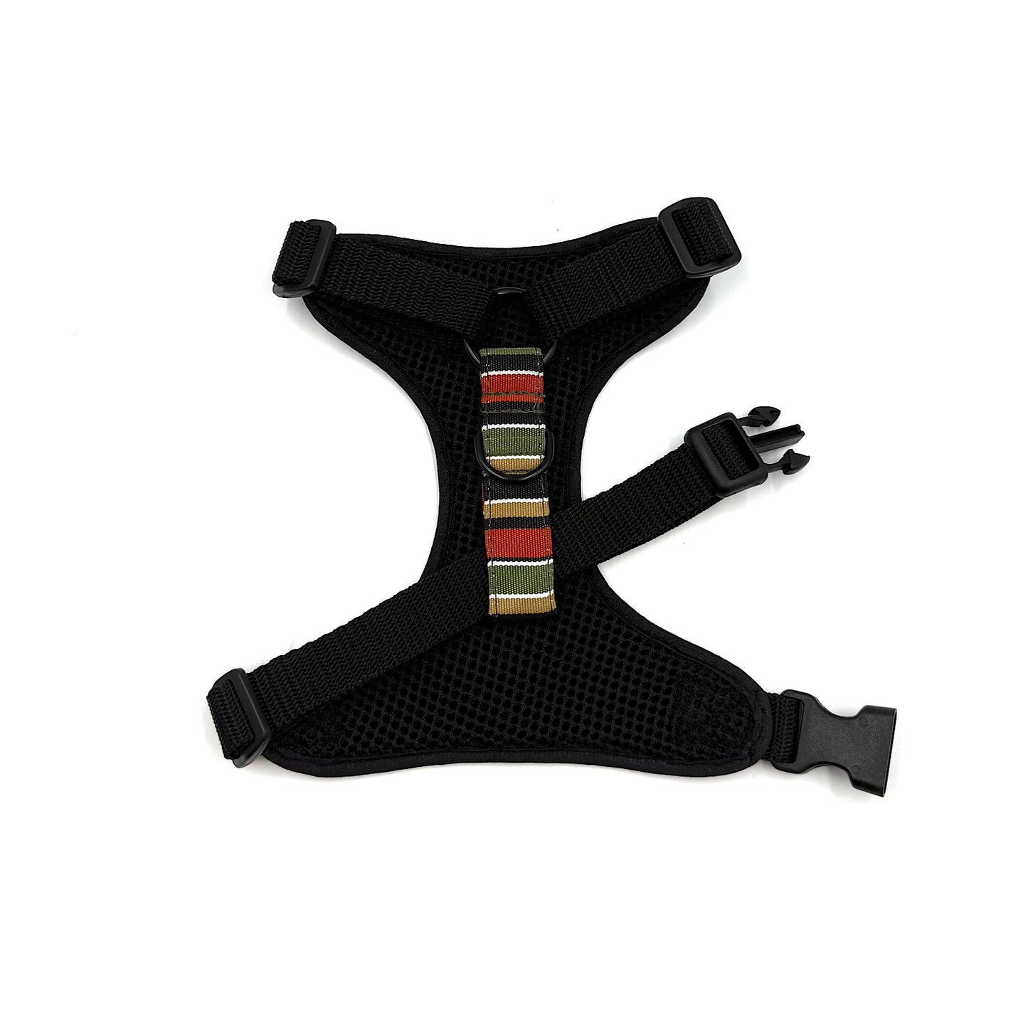Black dog harness with colorful striped buckle on a white background
