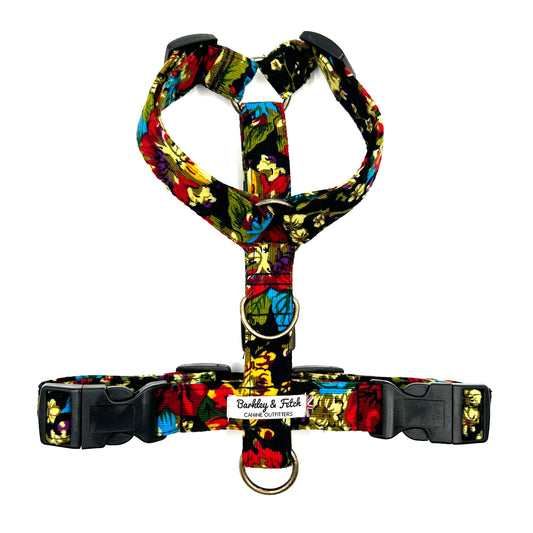 Colorful floral-patterned dog harness on a white background