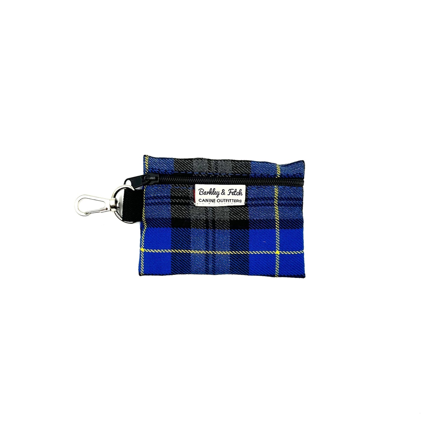 A royal blue tartan pattern poo bag holder with a label showing the brand name and website. It has a clip attachment for leash.