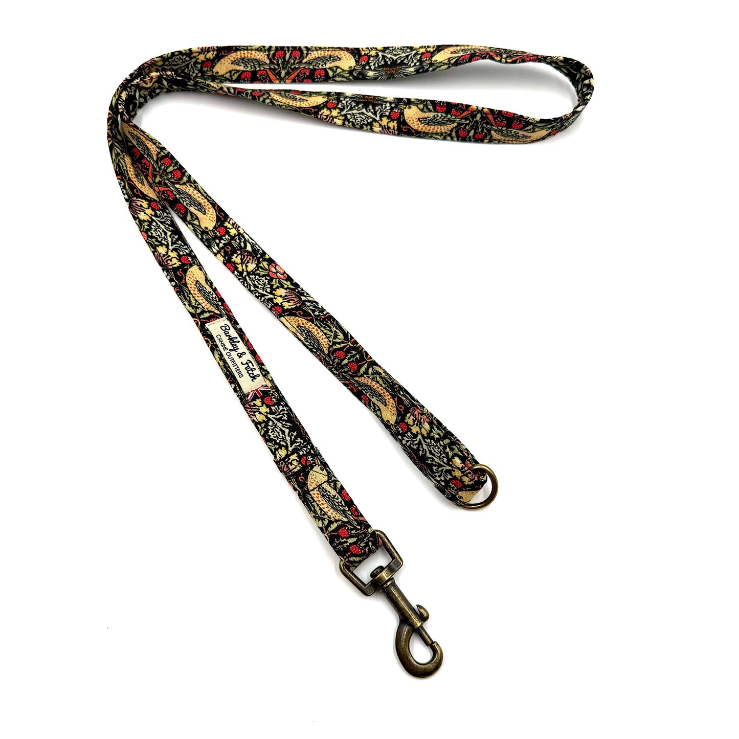 Decorative dog leash with paisley pattern on a white background