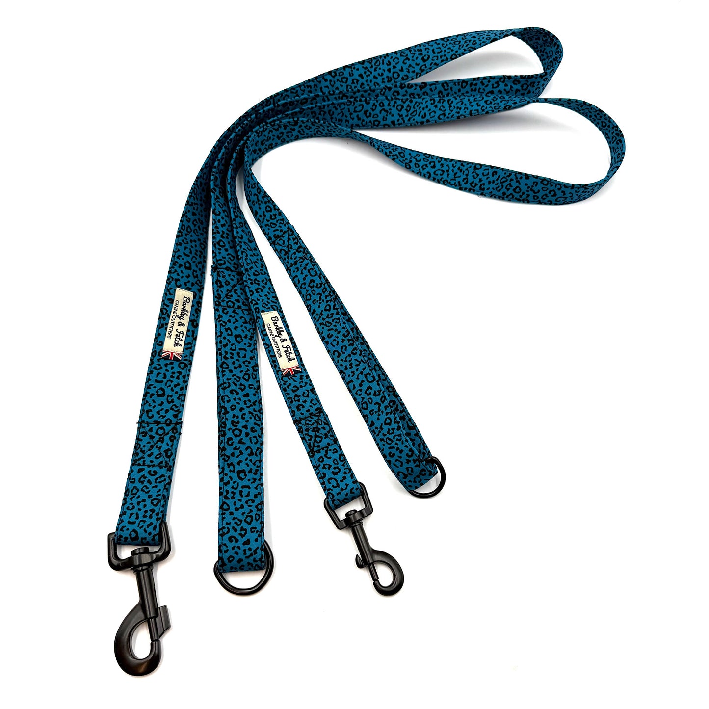 Blue patterned dog leash with black clips on a white background