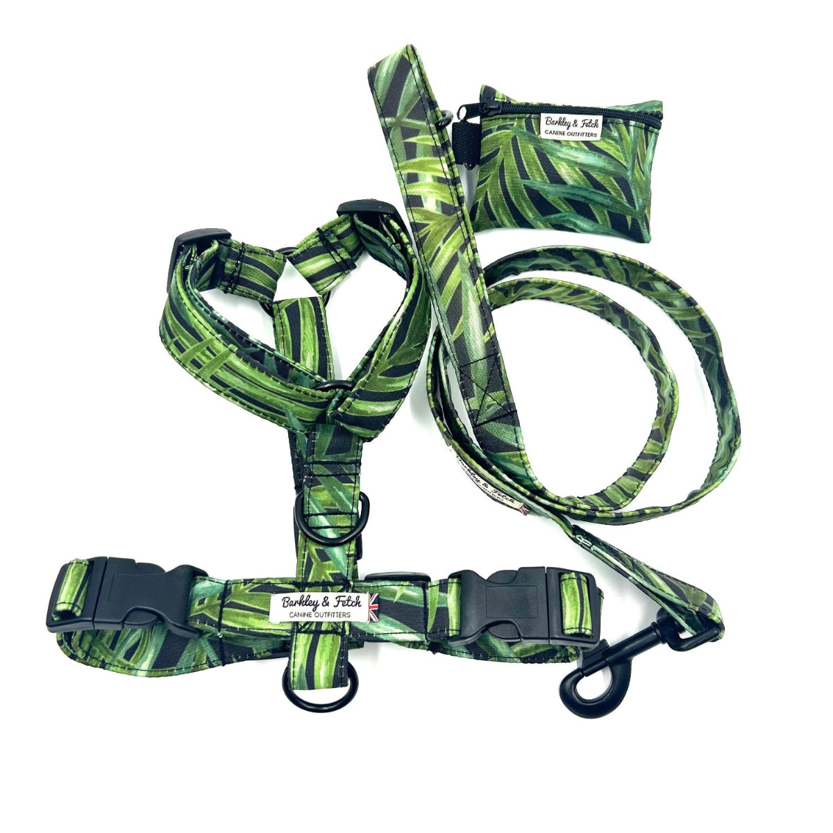 Green leaf-patterned dog harness, leash, and bag set on a white background