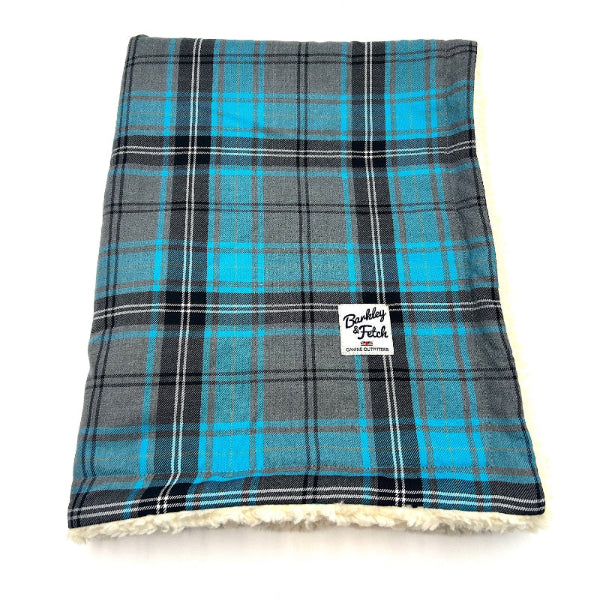 turquoise grey tartan and sherpa fleece dog blanket folded up on a white background turquoise grey sherpa fleece dog blanket