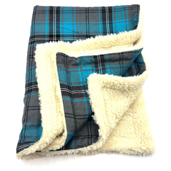 turquoise and grey dog blanket folded up on a white background handmade by barkley and fetch uk