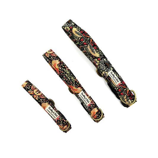 Three decorative dog collars with floral patterns on a white background