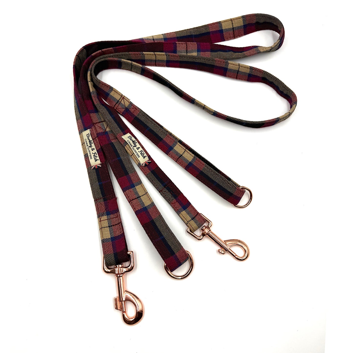 Plaid dog leash with rose gold clasp on a white background