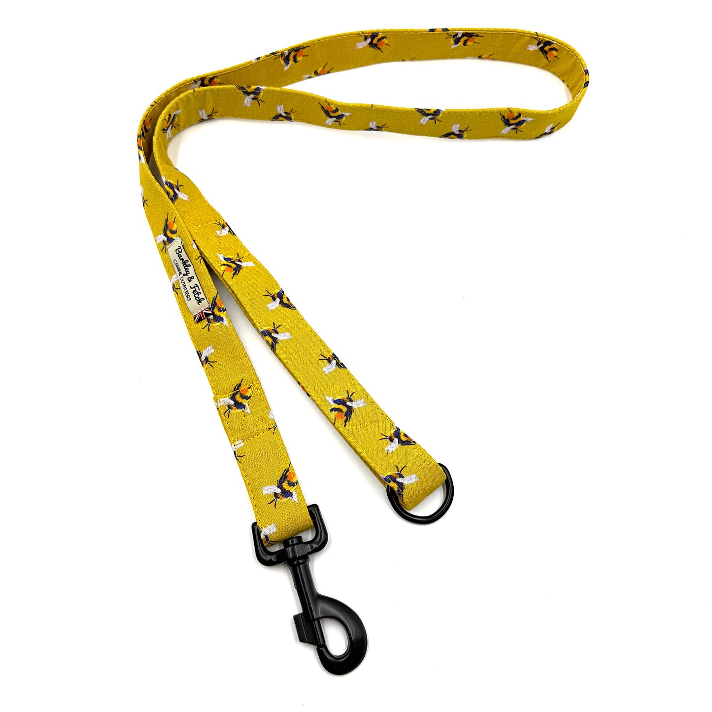 Yellow dog leash with bee pattern on a white background