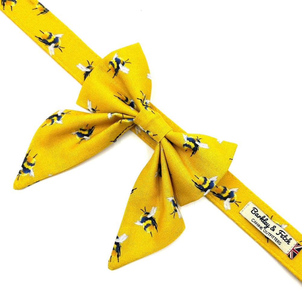 Yellow bow tie with bee pattern on a white background handmade in uk by barkley and fetch
