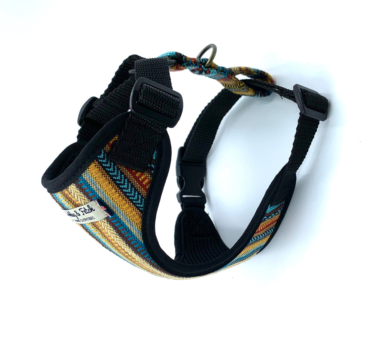 Dog harness with colorful pattern and black straps on a white background