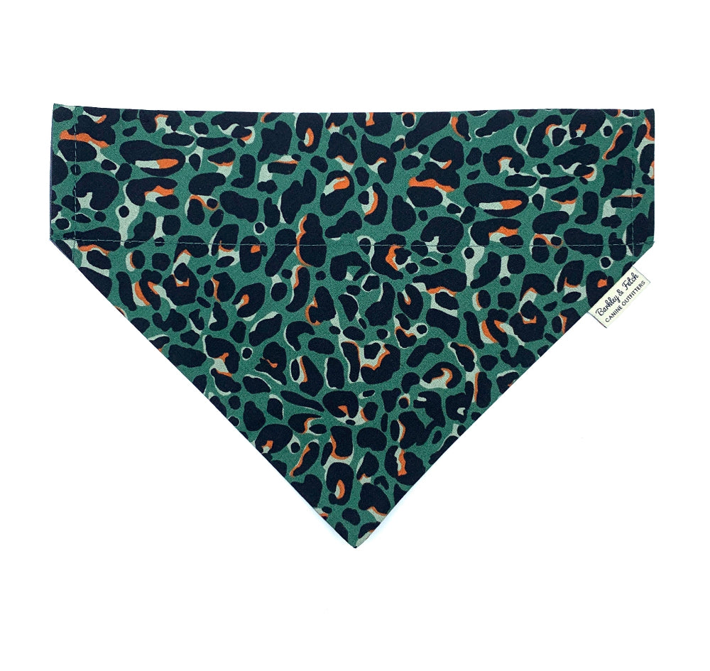 Leopard print bandana with a green background on a white background
