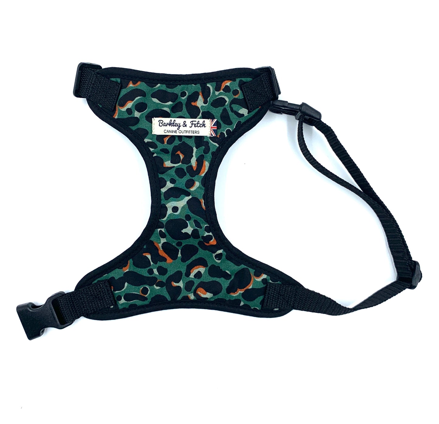 Green leopard print fabric harness for dogs with adjustable straps and a D-ring buckle, compatible with matching accessories.
