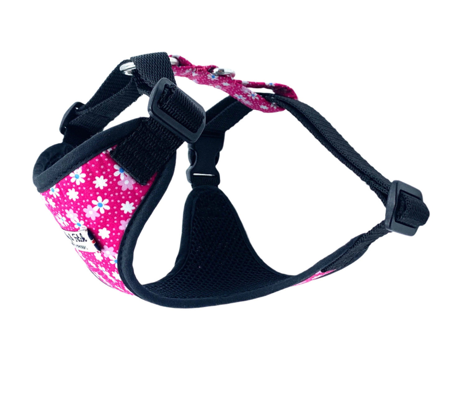 Pink floral-patterned dog harness with black straps on a white background