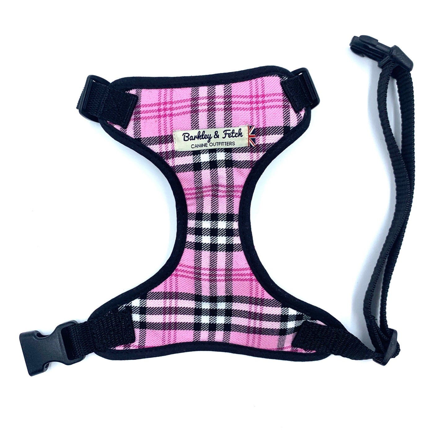 A pink check fabric harness for dogs with a black collar and a heavy duty d-ring, displayed against a white background.