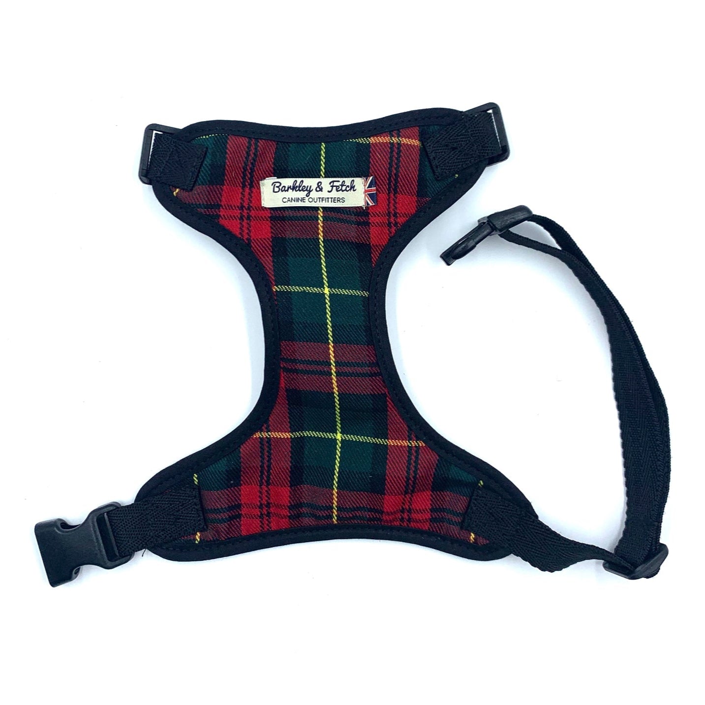 Plaid dog harness with visible brand label on a white background