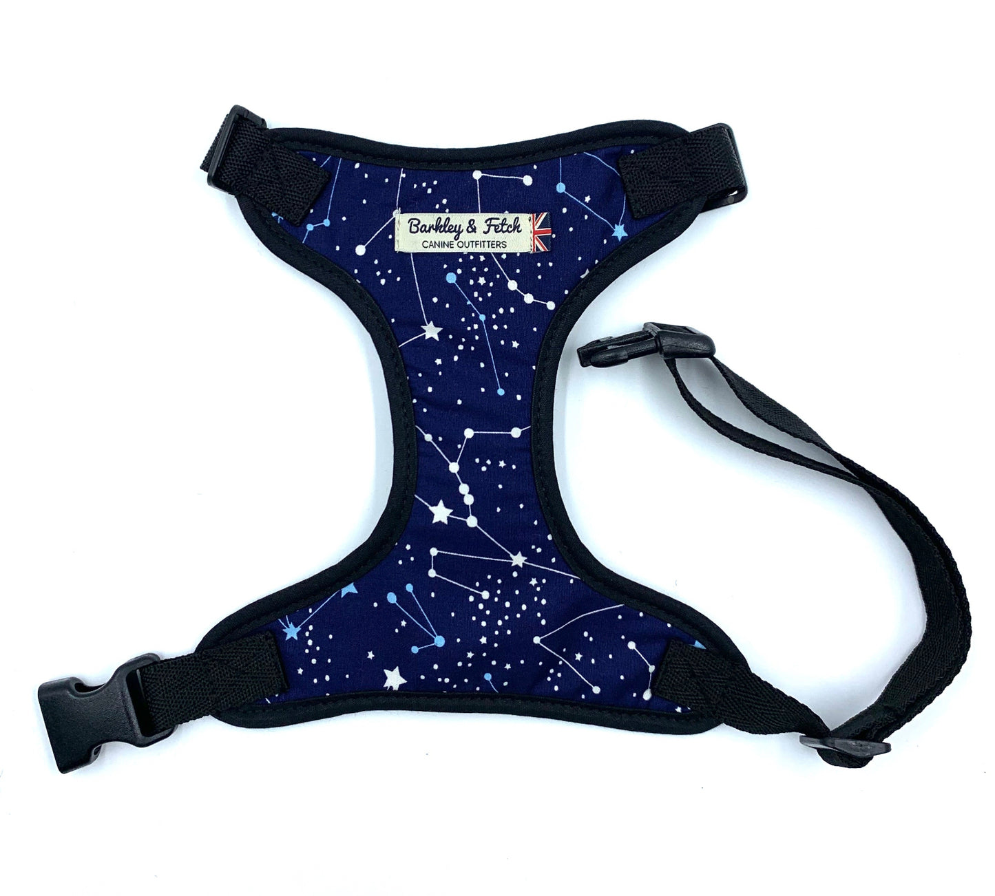A navy blue dog harness with a zodiac print, featuring a side release buckle and a welded heavy duty d-ring.