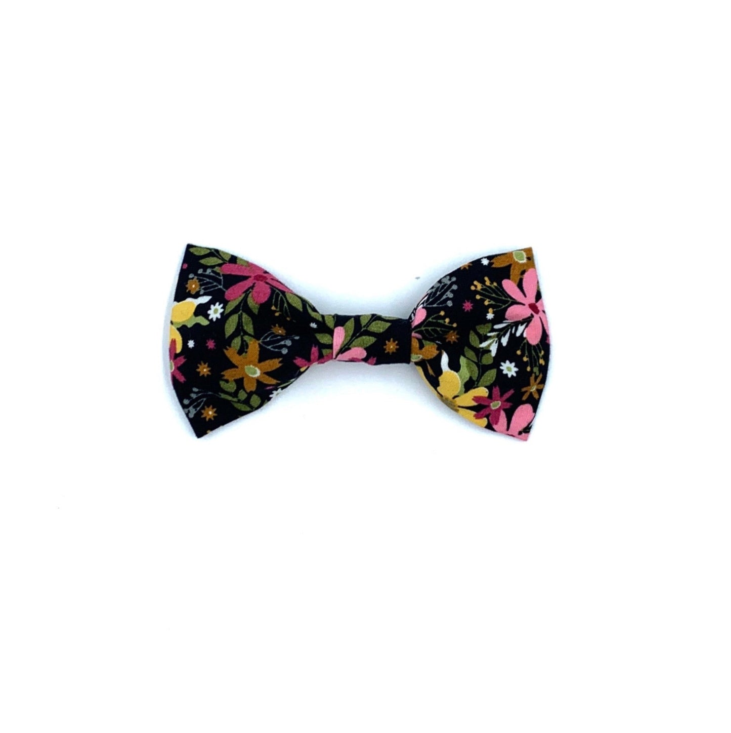A black dog bow tie with a floral print design on it.