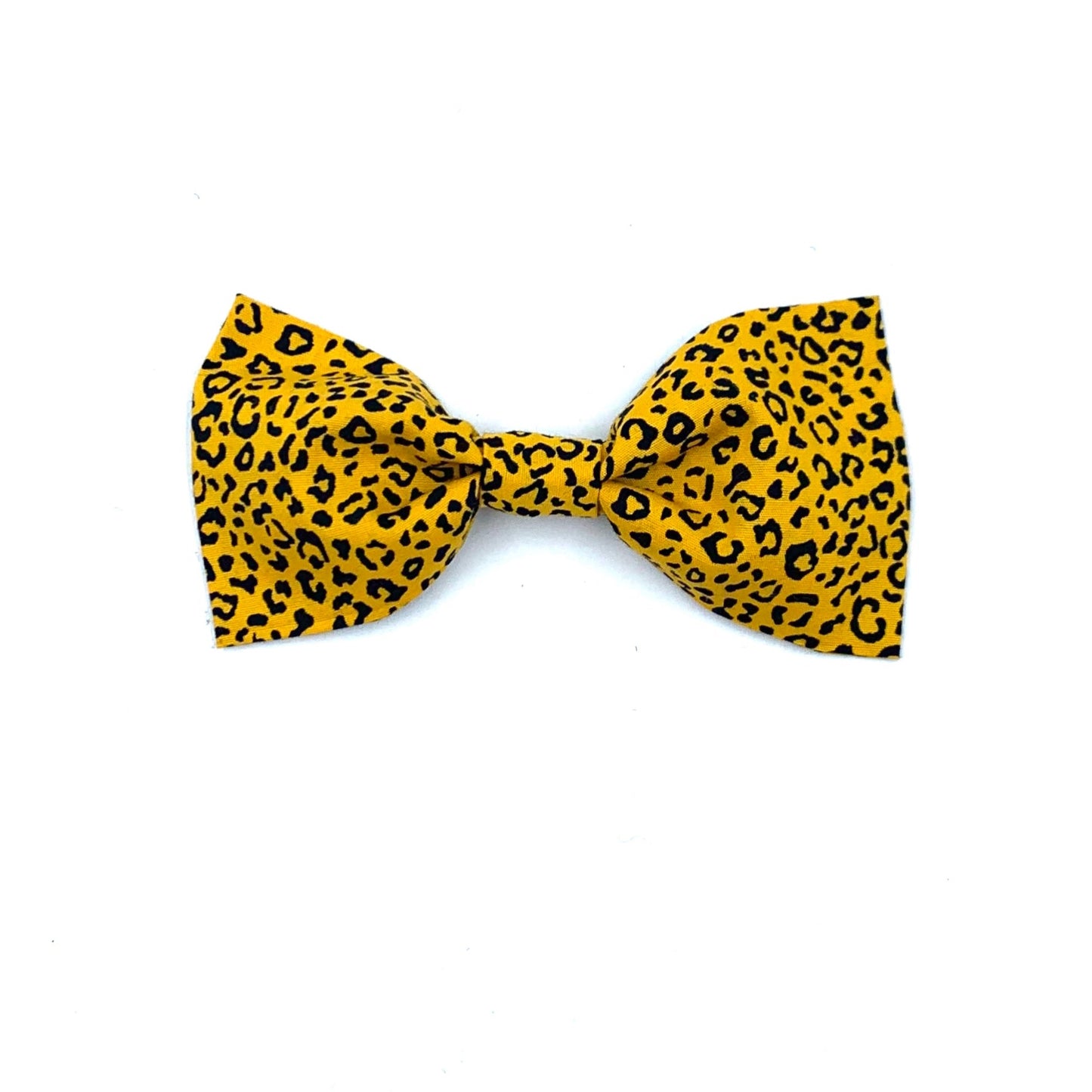 A yellow dog bow tie with leopard print patterns, tied at the top into a bow.