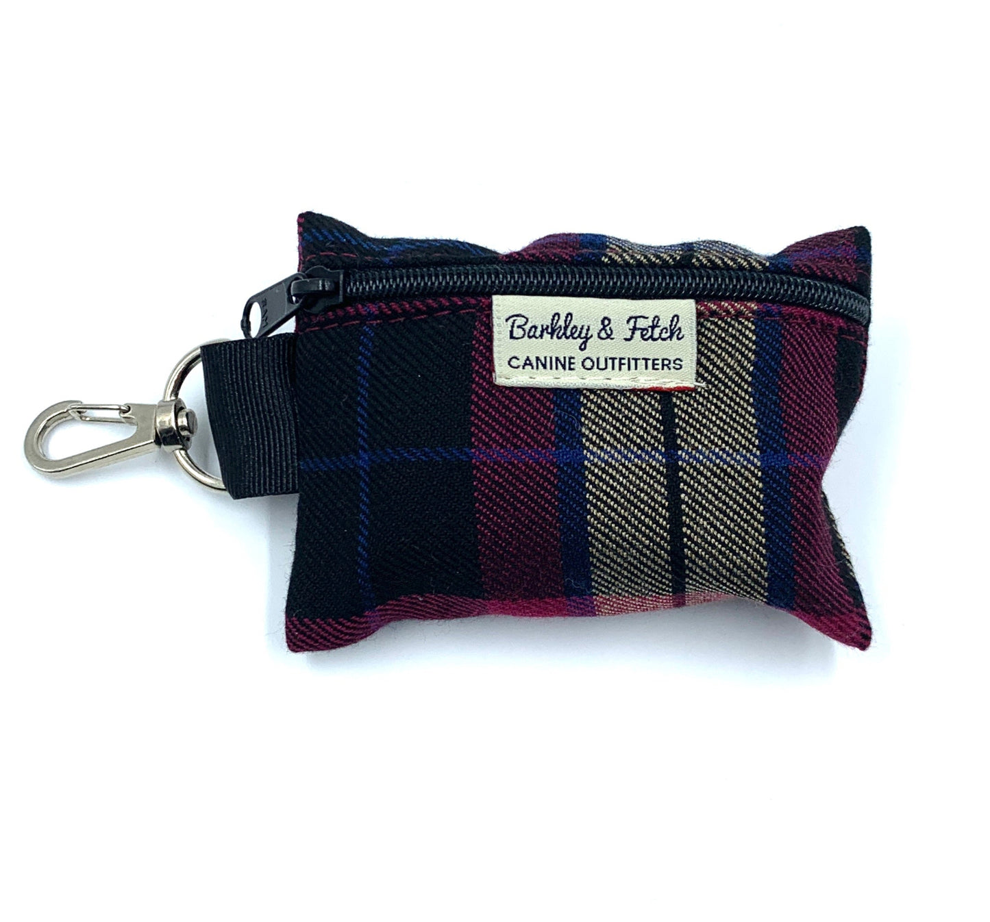 A wine tartan patterned poo bag holder with a metal clip and label, designed to attach to a dog leash.