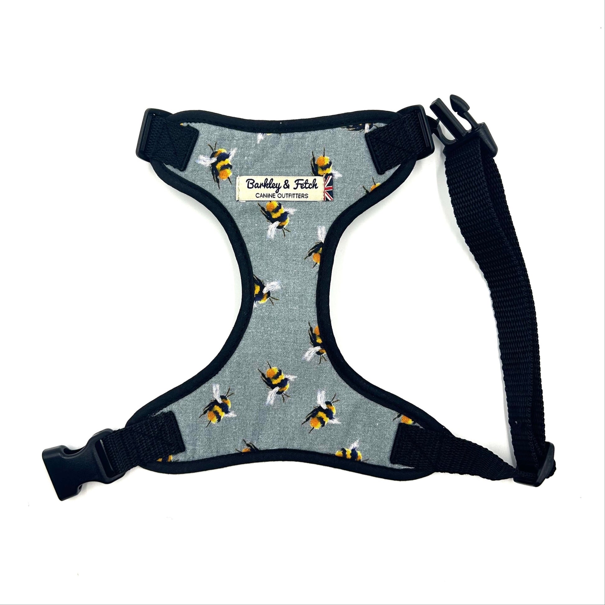 Dog harness with bee pattern on a white background