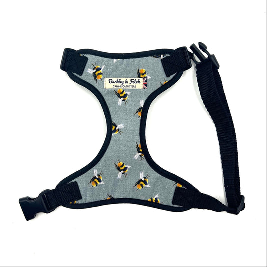 Dog harness with bee pattern on a white background