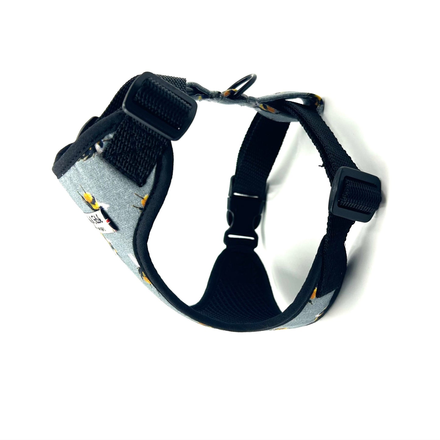 Dog harness with gray and black design on a white background