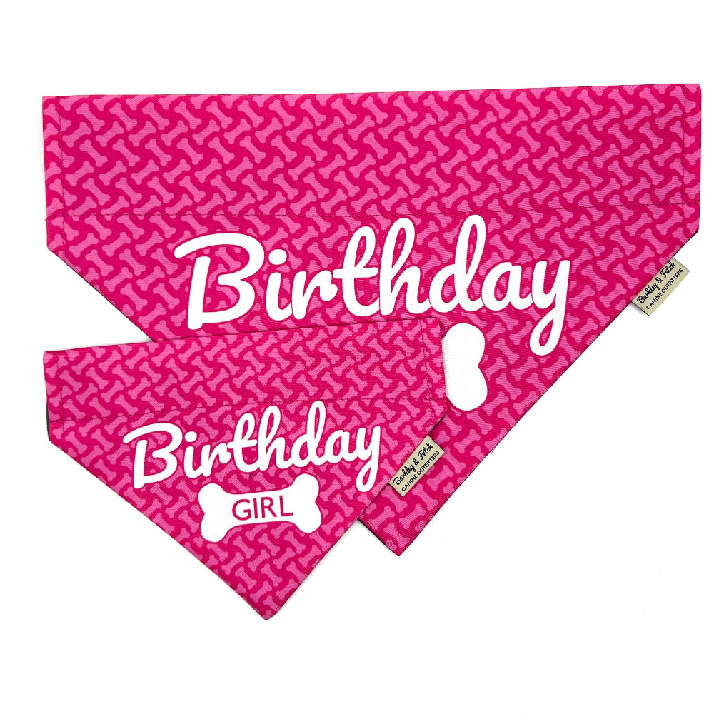 Pink dog bandana with 'Birthday Girl' text and bone pattern on a white background handmade in the UK by Barkley And Fetch