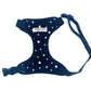 A black fabric dog harness with a star print, adjustable straps, and a heavy duty d-ring. It includes side release buckles and is branded with 'Barkley & Co'.