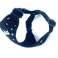 black dog harness with white star pattern on a white background